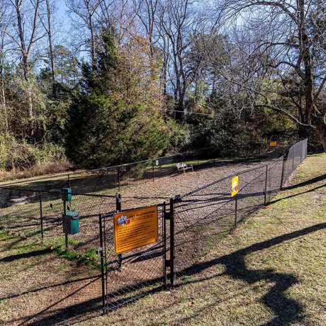 pet playground, fenced grassy area